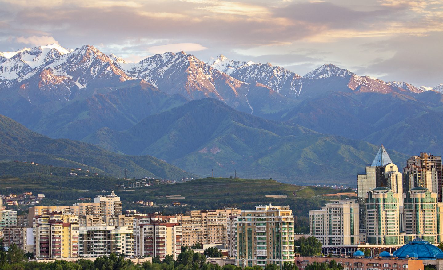 View over Almaty with snow capped mountains in the background, Almaty, Kazakhstan