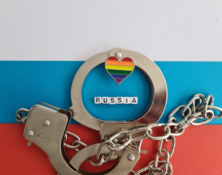Ban Russia and rainbow flag and handcuffs. LGBT conflict and rights concept